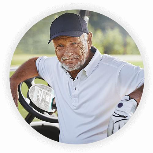 Older man playing golf after cataract surgery